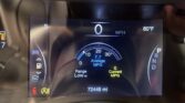 Car dashboard display showing current speed 0 MPH, outside temperature 80°F, and an odometer reading of 72,449 miles; includes average MPG around 7.7 and gear in Park (P).
