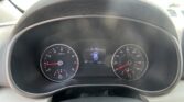 Driver’s view of the dashboard: tachometer on left, speedometer on right, and a central display showing vehicle status from the steering wheel perspective.