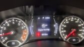 Car dashboard at night with speedometer and tachometer visible; center screen shows 'Engine Running' and 88,125 miles, warning lights lit.