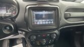 Dashboard of a car interior with central touchscreen, two air vents, and control cluster visible from the driver’s seat.