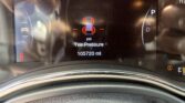 Vehicle dashboard: tire pressure warning with red '0' readings around car icon, speed 0, odometer 105,720 miles, gear in Park, 72°F.