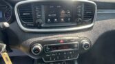 Car dashboard center console featuring a touchscreen display showing 'AV Off' with surrounding radio/media controls and climate dials.