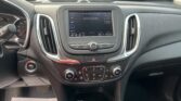 In-car view of the dashboard with a center touchscreen showing 'No Device Connected' and a floor sign reading 'We Take Pride In Your Vehicle'.