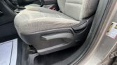 Front interior of a car showing the front passenger seat, center console, and gear shifter visible between seats.