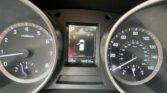 Car dashboard with tachometer and speedometer; center display shows Park and a car icon; odometer reads 104,612 miles; temperature 75°F.