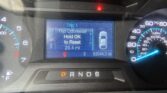 Dashboard: Center display shows Trip 1 navigation with 'Trip Odometer Hold OK to Reset' and mileage 29.4 mi; gear indicator below shows P as red warning light is on above.