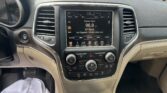Center console of a car showing the infotainment screen tuned to 96.9 FM Classic Rock.