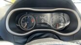Driver’s-eye view of the dashboard: tachometer and speedometer flanking a central digital display showing 0 mph, 78°F, gear P, and 102,883 miles remaining. The steering wheel is in the foreground.