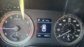 Close-up of a car instrument cluster: left tachometer, right speedometer, center digital display showing Park, a car icon, 91 miles remaining, outside temperature 68°F, and odometer reading 55,241 miles.