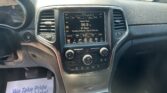 Center console with a touchscreen showing Classic Rock on 96.9 and climate controls visible around the display.