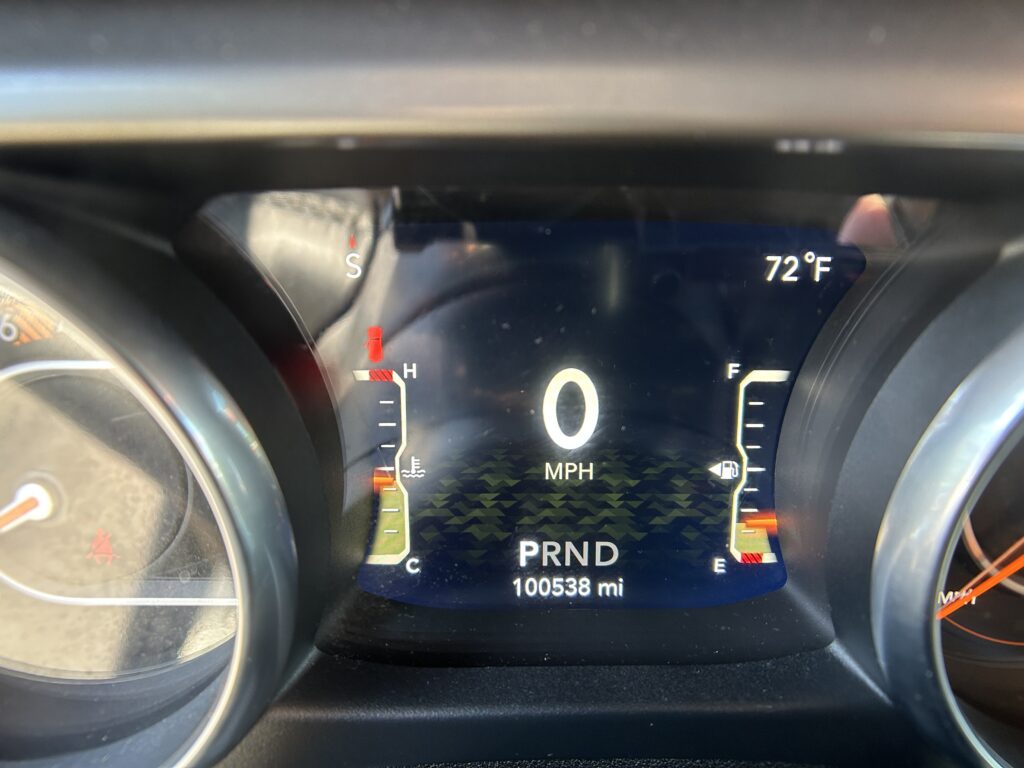 Digital instrument cluster: 0 MPH, outside temperature 72°F, gear in Park (PRND), odometer at 10,0538 miles, compass pointing South (S).