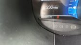 Dashboard display showing distance to empty 236 miles and an odometer reading of 94,848 miles with a fuel gauge on the right and a red warning icon nearby.