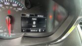 Car instrument cluster: speedometer at 0 mph, red seatbelt warning lit, digital display showing 'Trip' and 'Vehicle' with speed '0 MPH' and odometer around 82,050 miles.