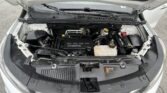 Open hood view of a car engine bay with an EcoTec engine and visible batteries and fluids, front angle (informative).