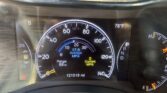 Close-up of a car's instrument cluster showing speedometer with mph, current MPG, range, and odometer reading 121,019 mi; outside temp 78°F.