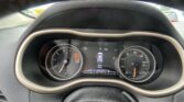 Dashboard view from behind the steering wheel showing the tachometer (left) and speedometer (right) with a center display indicating a door is open and the odometer at 95,996 miles.