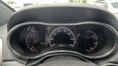 Driver's view of the car dashboard with the speedometer and tachometer visible, odometer reading 89,447 miles, and the steering wheel at the top of the frame? (informative)
