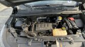 Open car hood showing engine bay with ECOTEC engine cover, battery, and coolant reservoir visible