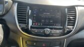 Dashboard touchscreen showing FM radio interface, currently on 96.9 with options for Sound and Browse