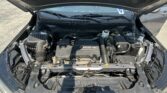 Open car hood exposing the engine bay, with the ECOTEC engine cover visible at the center.