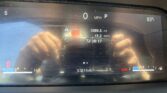 Car dashboard display showing 0 MPH in Park, outside temperature 83°F, trip 1089.3 mi, fuel economy 15.2 MPG, odometer 97,819 mi, brake warning light present.