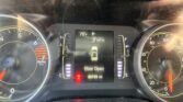 Vehicle dashboard showing center digital display with 0 MPH, 79°F, gear P, and 'Door Open' warning; tachometer and speedometer visible on sides.
