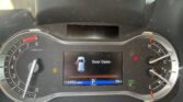 Center display shows a 'Door Open' warning with a car icon; odometer reads 115,953 miles, gear is in Park (P), outside temp 79°F.