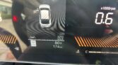 Top-down view of a car on the dashboard with the left front door open and a red seatbelt warning light active, plus temperature (80°F) and mileage (174 mi) readouts.