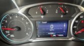 Close-up of a car dashboard showing the speedometer at 0 mph, tachometer around idle, and a digital display reading 0 mph with 101,085 miles.