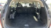 Open SUV cargo area with rear seats upright and ample space in the trunk area for cargo or passengers.